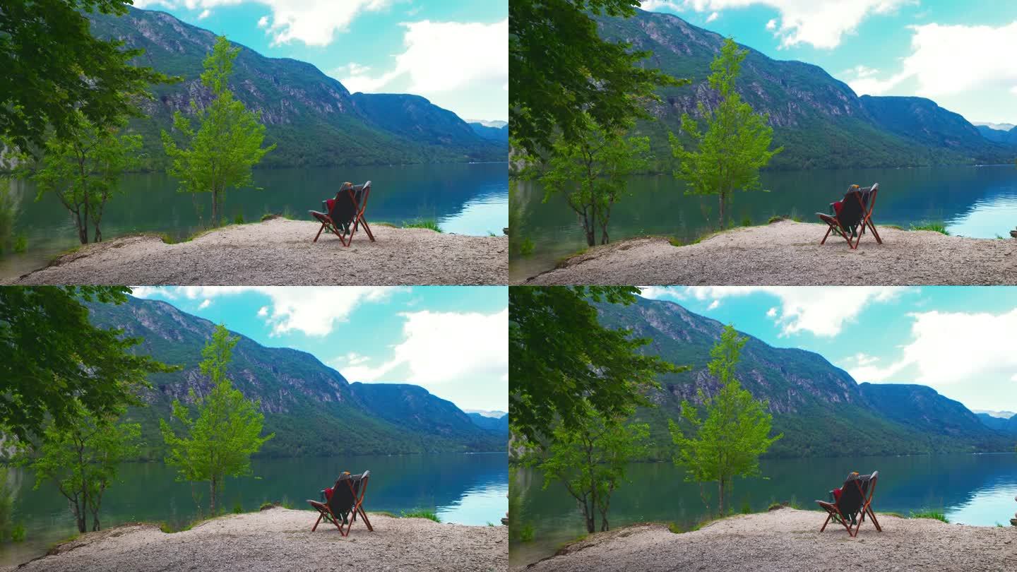 田园诗般的湖前，岩石上的一张椅子