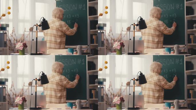 高级女教师在黑板上写数学方程式，讲解任务