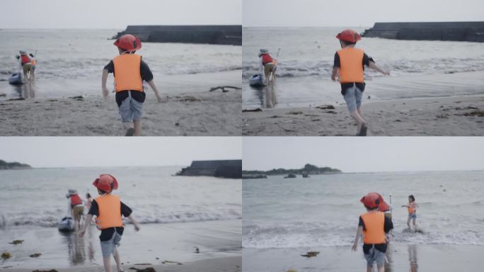 小日本男孩在海滩上玩得很开心