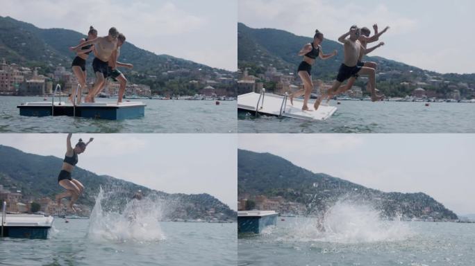 意大利利古里亚，青少年在海上的浮动平台上玩耍