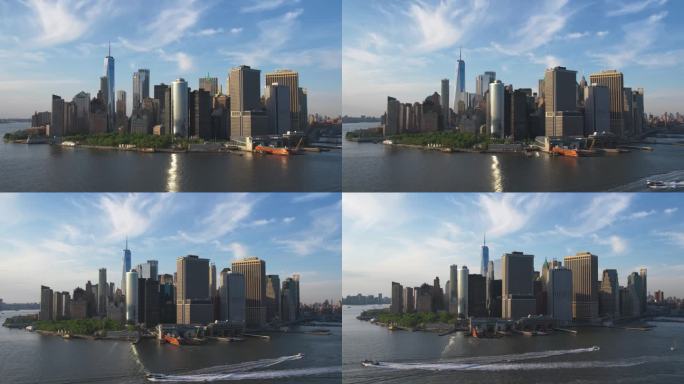 美国纽约华尔街金融区全景飞行。空中拍摄的办公大楼和摩天大楼在一个夏日晴朗的日子，蓝天和轻云