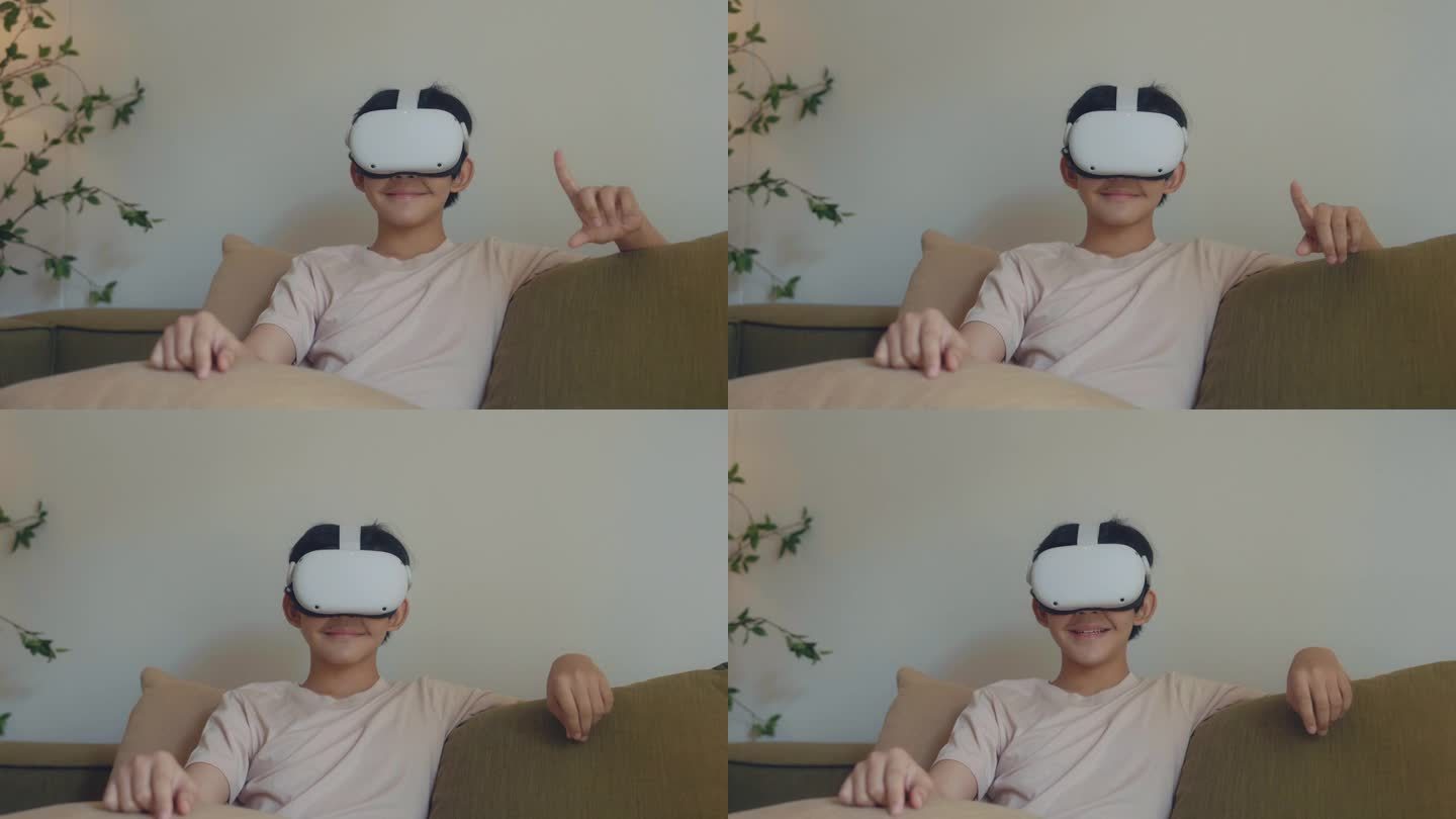 快乐的男孩坐在客厅的沙发上体验虚拟现实。