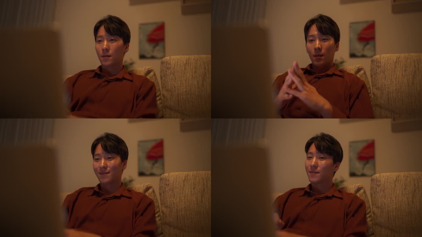 一个韩国男性的肖像专注于虚拟工作从家里，使用笔记本电脑进行生产任务管理，为他的经理创建详细的报告和演