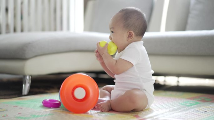 8 Month old baby boy happy and funny playing with 