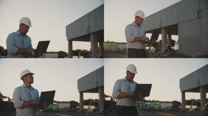 拿着笔记本电脑的男工程师走过在建的大楼