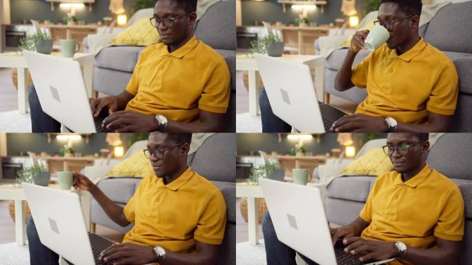 一名非裔美国人一边在家用笔记本电脑工作，一边喝咖啡