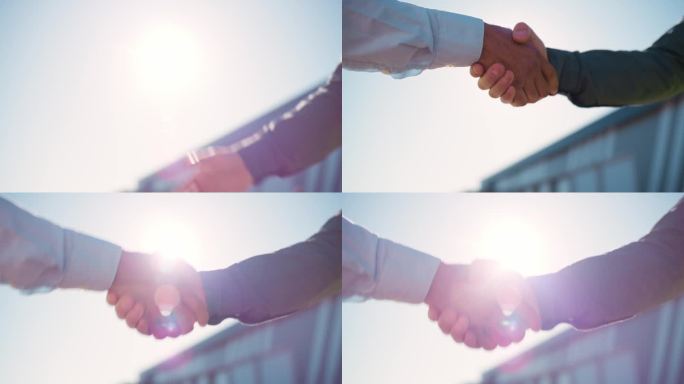 商务人士在户外开会、交易或达成协议时，在城市中握手和合作。在b2b、协作或团队团结中，男性在介绍、问