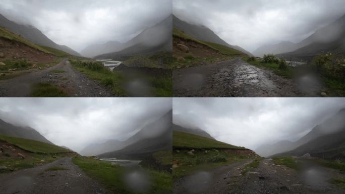 在夏日的雨中驾车行驶在山河岸边。汽车的观点