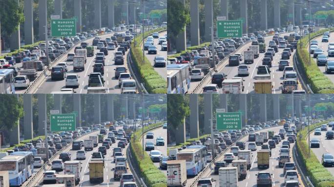 在雅加达的3条城市道路上，许多车辆在繁忙的交通和交通堵塞中通行。有绿色道路目的地指示。