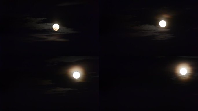 月亮上升。月亮上升。白色的月亮划过黑色的天空。月光。白色的月亮穿过黑色的天空。每月从云层后面出来的圆