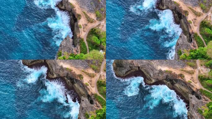 鸟瞰特写镜头，海浪冲击着印尼巴厘岛努沙佩尼达岛沿岸的岩石