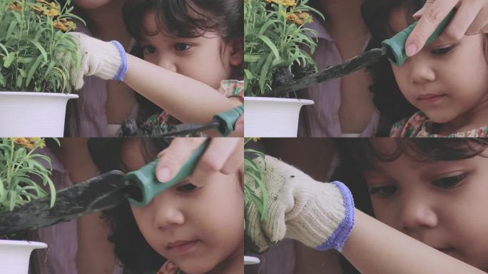 小女孩正在给植物浇水