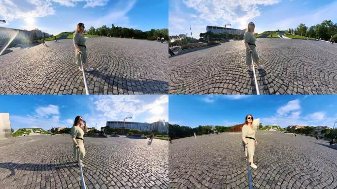 在布达佩斯广场拍摄自拍视频的年轻女游客。