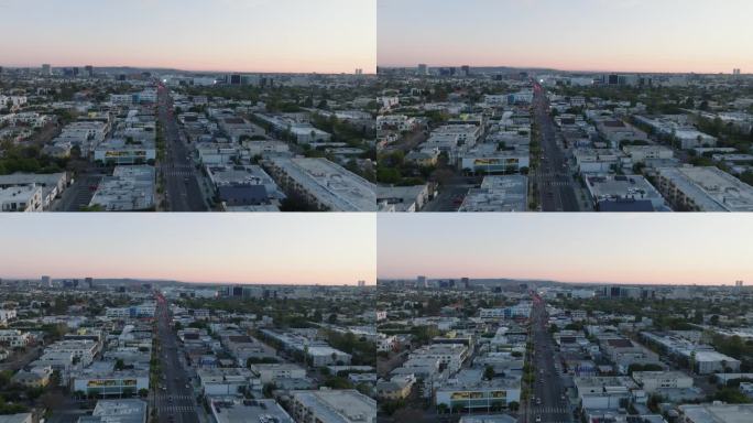 都市各种建筑的鸟瞰图。黄昏时分市区街道上的交通。