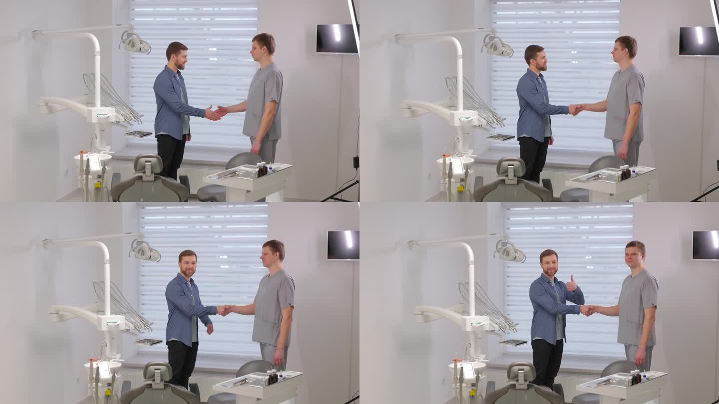 医生接见病人。一名男子站在办公室牙医椅旁与牙医握手