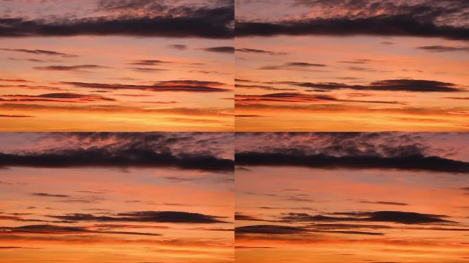 橙红色的晚霞配上美丽的云彩，通道，飞翔，天空，太阳的背景。日落天空戏剧性的