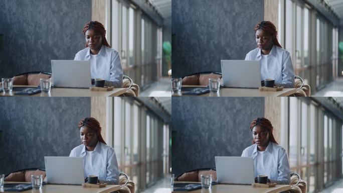 成功的商人:黑人企业家在网上有效地管理她的生意