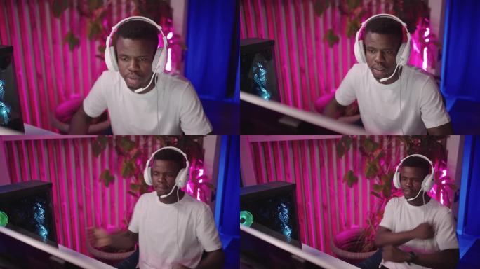 一个从事电子竞技的年轻黑人男性的肖像:与他的团队玩电子游戏，通过耳机交流，直播他的游戏玩法，并在空闲