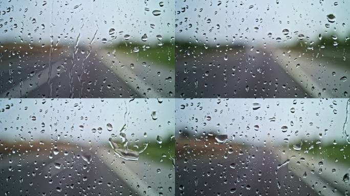 雨落在高速公路上行驶的汽车上