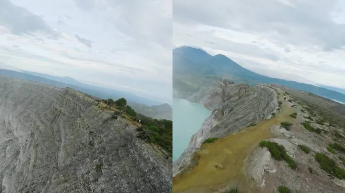 垂直视频4k。火山口有绿松石酸性湖泊，游人漫步