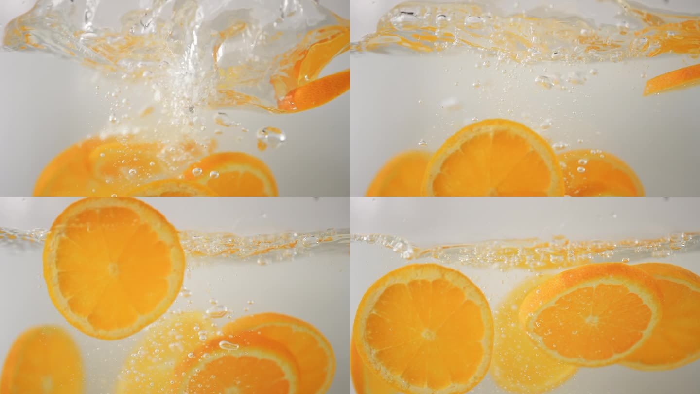 橙子片落入水中的慢动作视频