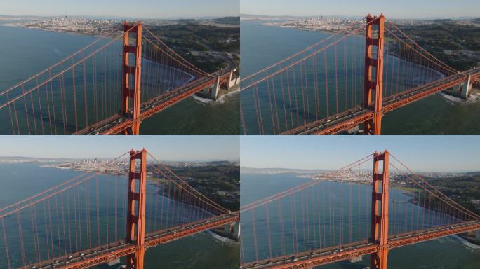 高钢桥塔和大都市背景的航拍画面。金门大桥上的交通。美国加州旧金山