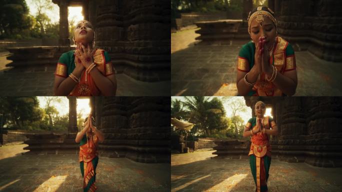 一个印度女孩在一座古老的寺庙里练习婆罗那塔yam艺术的戏剧表演。富有表现力的年轻女性穿着五颜六色的传