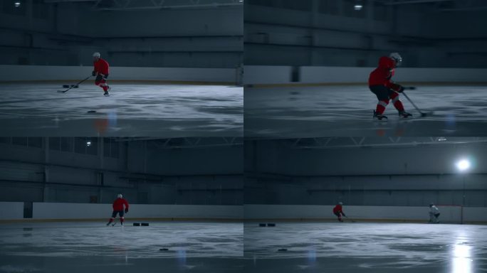 一名技术娴熟的冰球运动员身穿红色球衣，在黑暗的冰场上训练，在进球时展示了令人印象深刻的速度和准确性