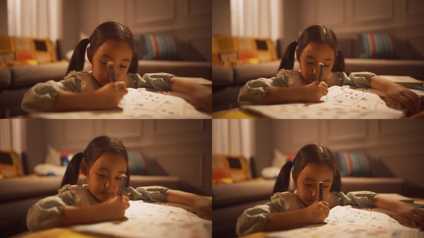 一个可爱的韩国小女孩在家里客厅的涂色书上画画的特写肖像。聪明又有创造力的女孩晚上学习、学习、做作业