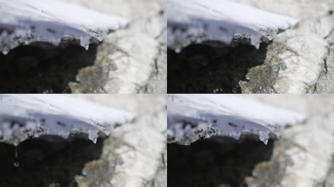 冰川融化的细节，水滴从冰上落到岩石上