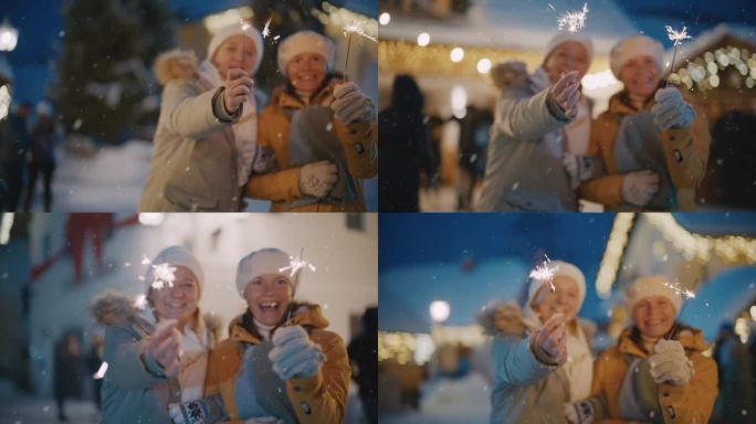 下雪的时候，妇女们在圣诞市场上欣赏炫目的烟花。圣诞集市上的欢乐时光。