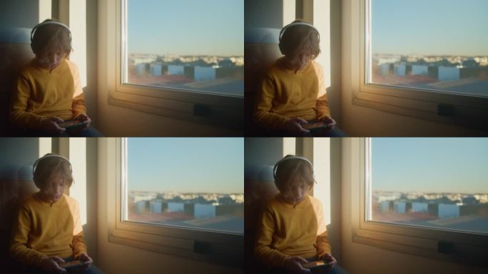 少年在Dawn by Window玩手机游戏