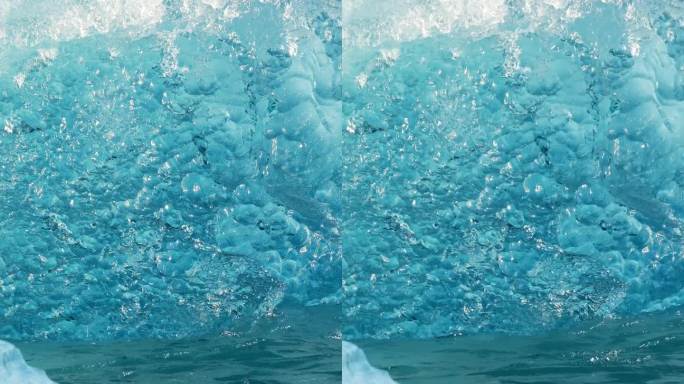 竖屏:北极的纯蓝冰。冰岛的冰山从冰川中分离出来。清澈的蓝冰漂浮在蓝绿色的海水中。为社交媒体拍摄。杰古