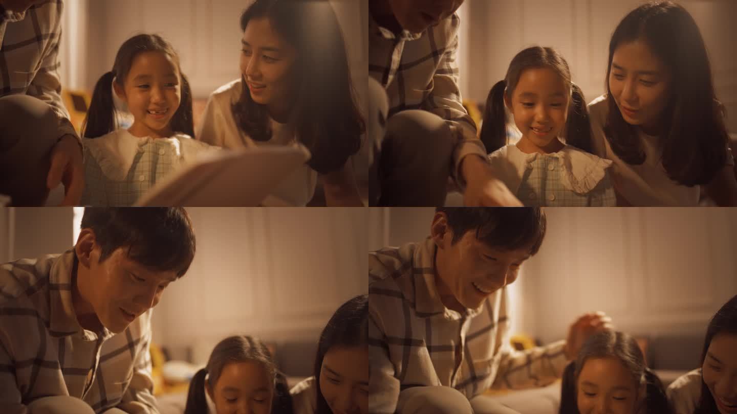 可爱的韩国女孩的特写，在温暖的灯光下，在舒适的公寓里向爱她的父母展示她的画。骄傲的父母支持艺术女儿，