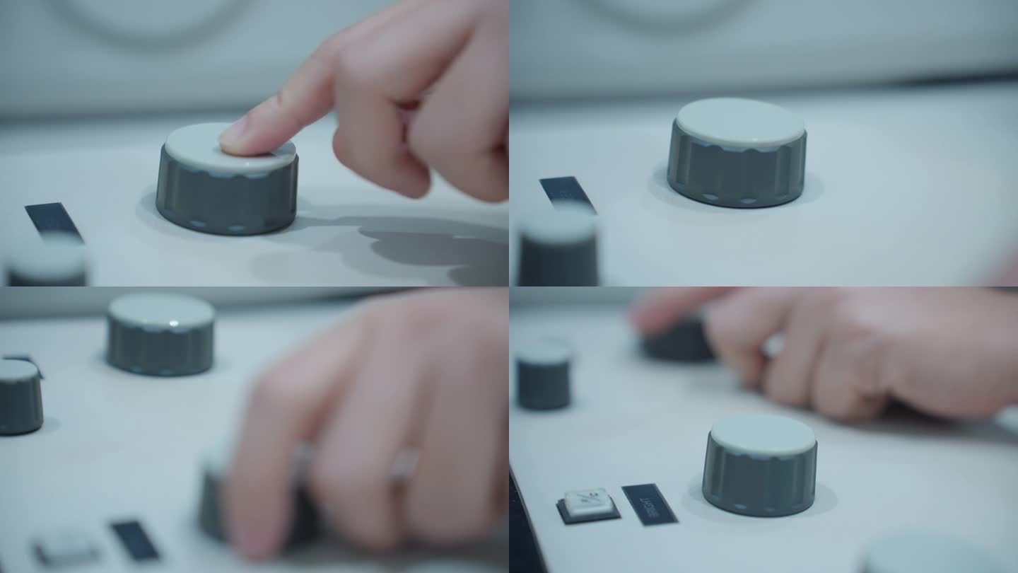 扫描电子显微镜的控制面板正在由一位女科学家的手调节。用手指转动塑料制成的旋钮。