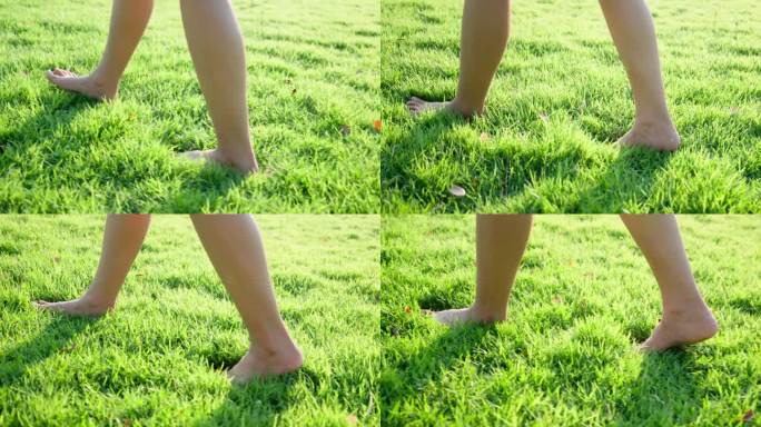 光着脚在草地上走。赤脚踩在公园草坪上的特写镜头