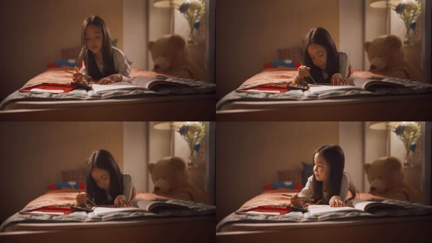 一个韩国小女孩躺在家里儿童卧室的床上用彩色铅笔在笔记本上画画的肖像。可爱的亚洲孩子在她舒适的房间里玩