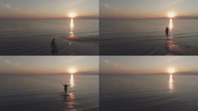 从空中向前飞行，看到一个十几岁的女孩赤脚跑到波罗的海的海滩上，在日落时分举起手臂