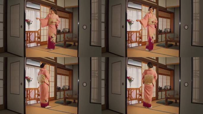 日本穿着传统服饰的女性。年轻美丽的日本女人穿着粉红色的和服和鲜花在家里摆姿势拍照。亚洲模特在镜头前展