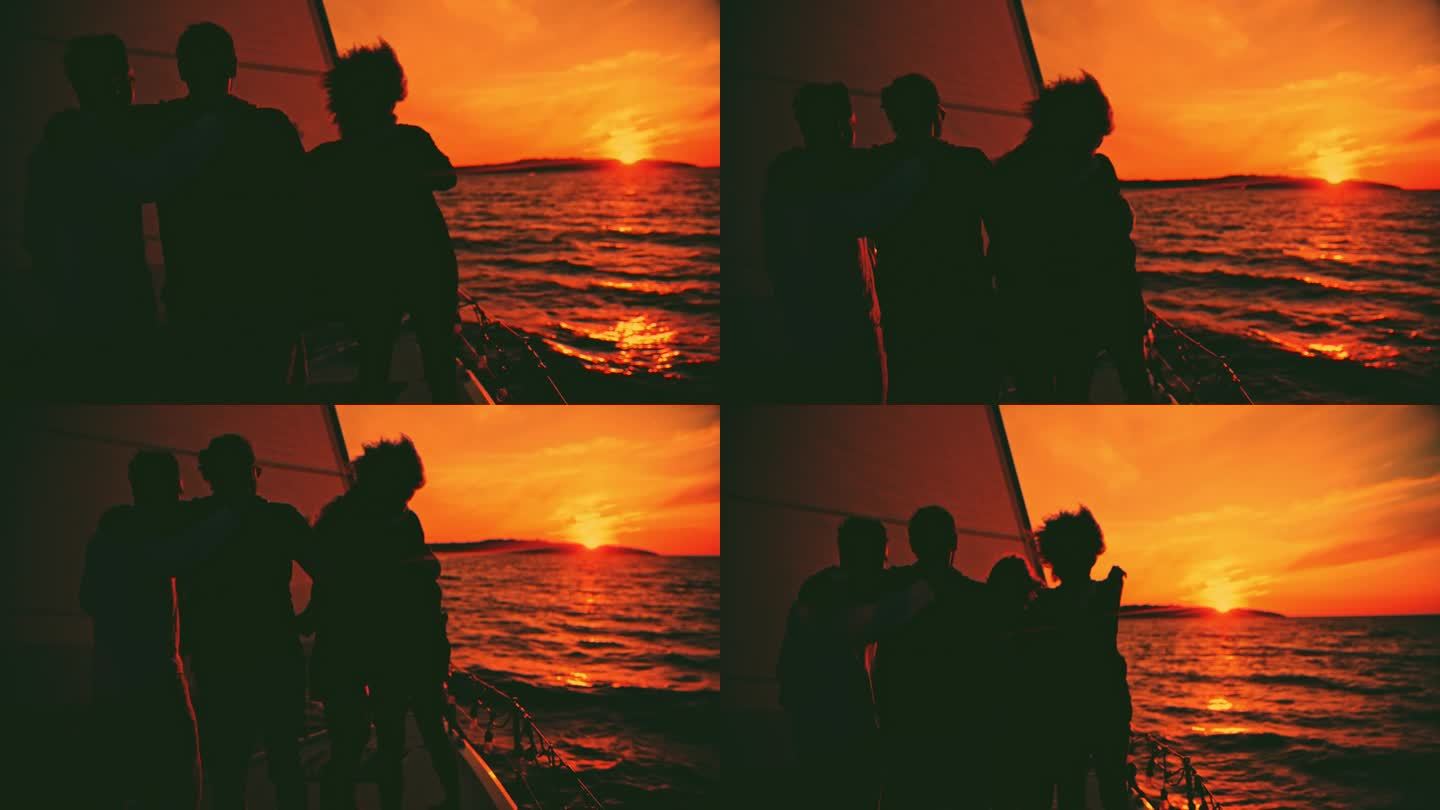 夕阳下，朋友们在游艇上相互拥抱