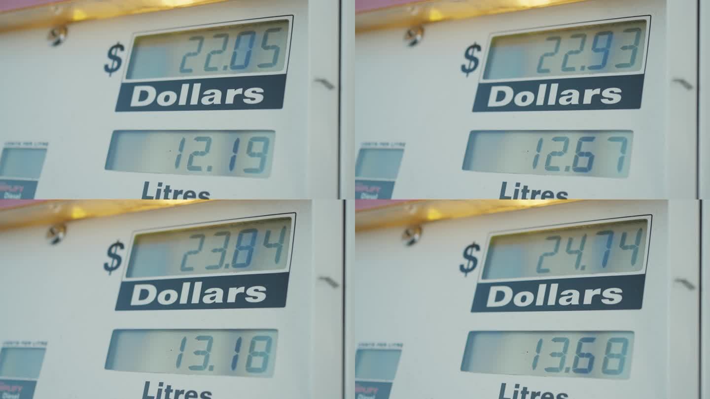 在加油站油泵屏幕上显示不断上涨的汽油价格、通货膨胀、高生活成本的概念