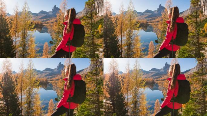 女性徒步旅行者在秋天探索山湖山谷的壮丽景色