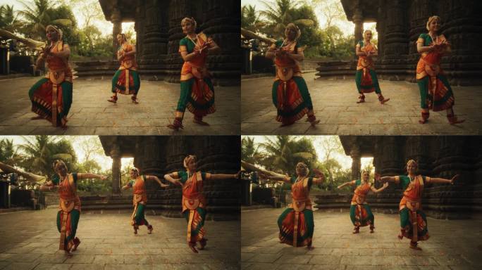 三位富有表现力的年轻印度舞者在古庙中表演民间舞蹈的慢动作肖像。穿着传统服装的妇女穿着五颜六色的纱丽跳