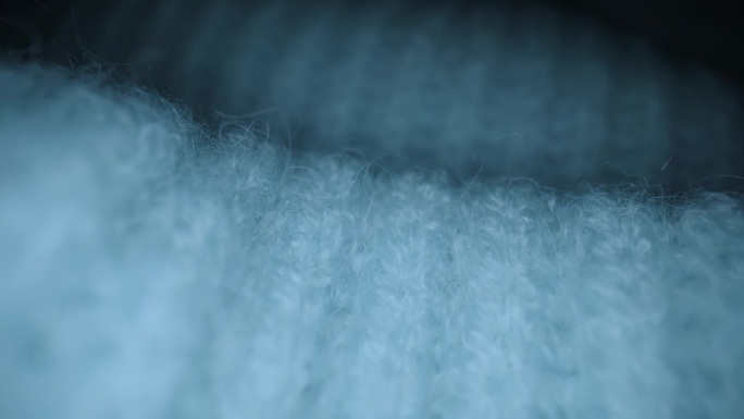 微距镜头毛料，针织毛线套头衫。多丽服装的特写材料有蓝毛纺、毛纺、羊毛纤维
