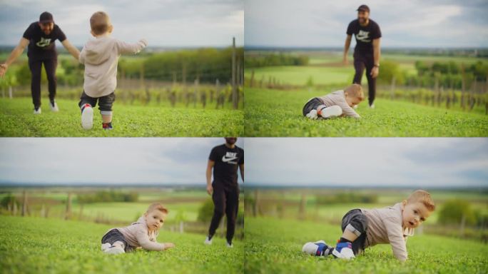 父亲鼓励可爱的小男孩在草地上学习走路
