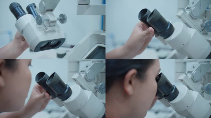在扫描电子显微镜上，一位女科学家调整她眼睛的焦点来观察微小的细节。