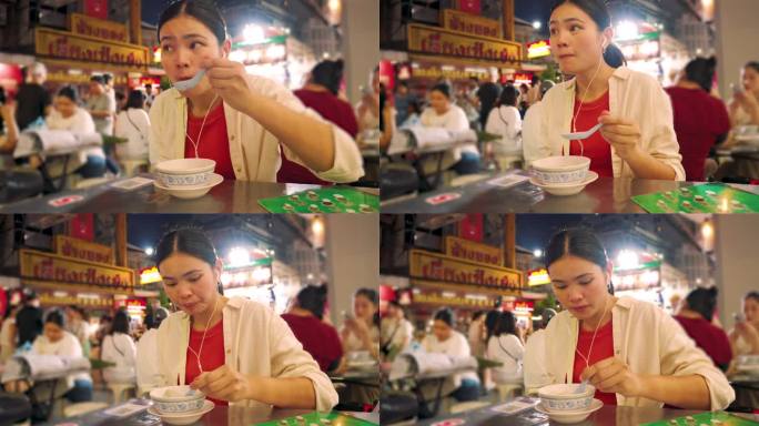 泰国游客在泰国曼谷的唐人街拍照和吃饭。