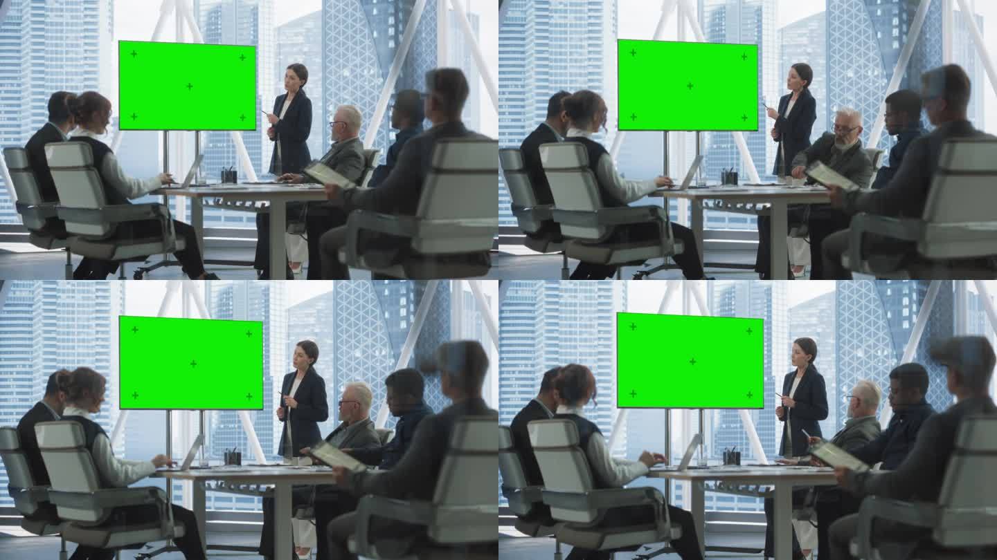 办公室会议室演示:美丽的女商人演讲，使用绿屏色度键电视机。数字企业家在会议上展示电子商务产品与集团不