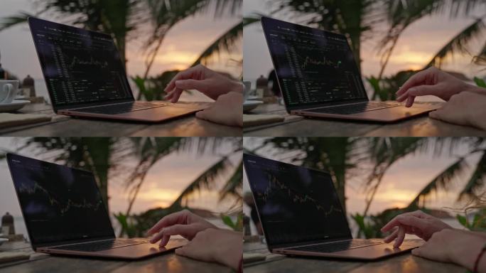 女性加密货币交易员在笔记本电脑上查看在线烛台图，在热带海滨户外咖啡馆远程工作。女经纪人分析汇率和押注
