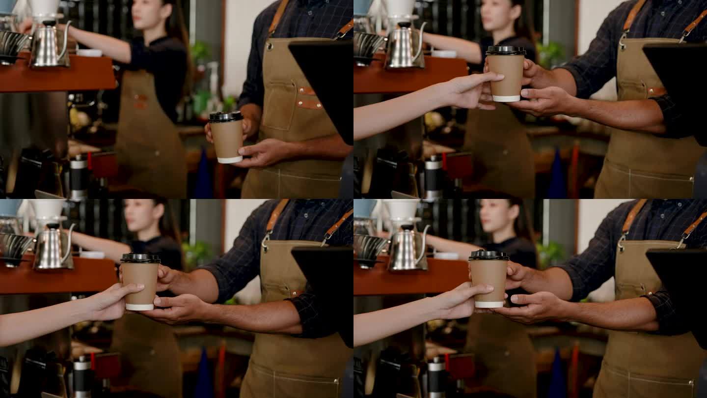肖像咖啡杯，小尺寸的纸杯，用于饮用热菜单，咖啡师手持纸杯，从柜台伸出来为顾客点这杯咖啡，顾客伸手拿起